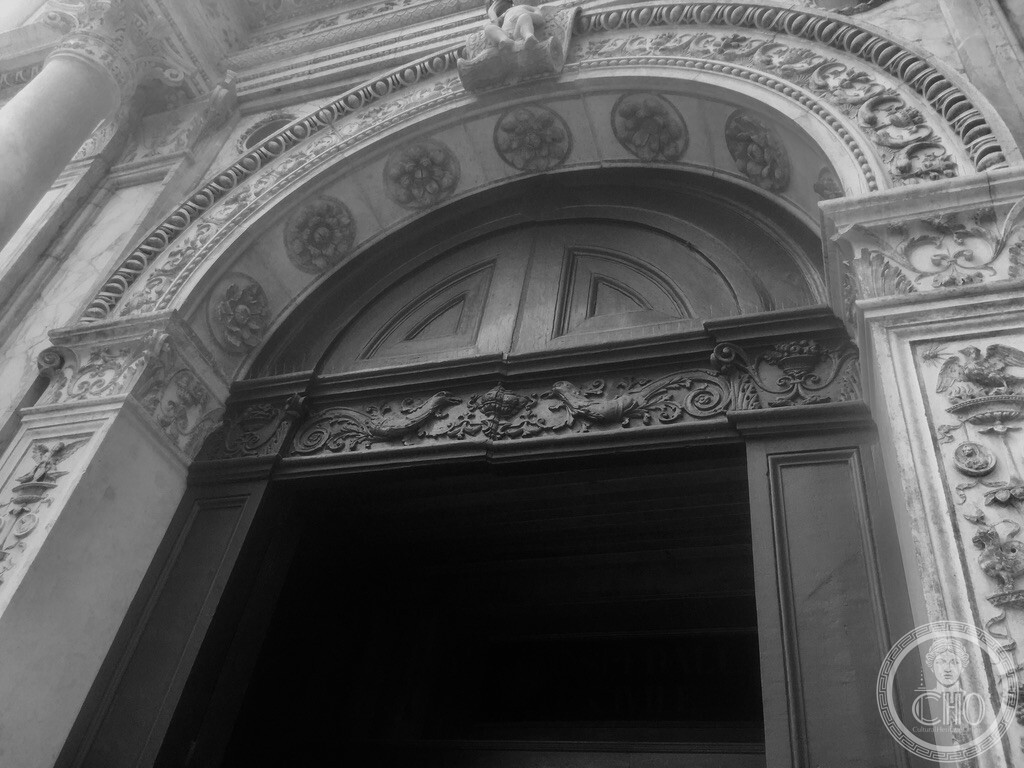 Sculpted Renaissance portal arch with stone rosettes at Scuola Grande di San Marco in Venice