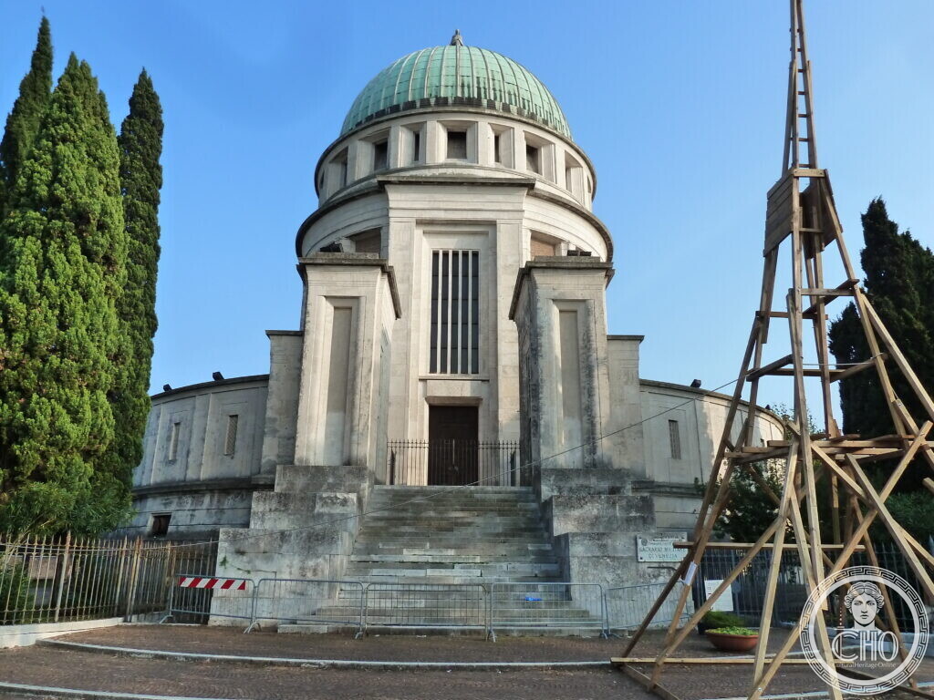Side view of the domed shrine with its cypress trees and the rotunda of side chapels