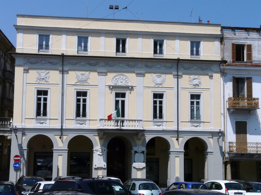 The brick courtyard and arched loggia of Palazzo Valentino in Valenza