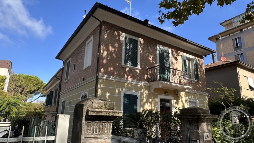 The corner of the pair of villini, with heavy stone gate piers in the foreground