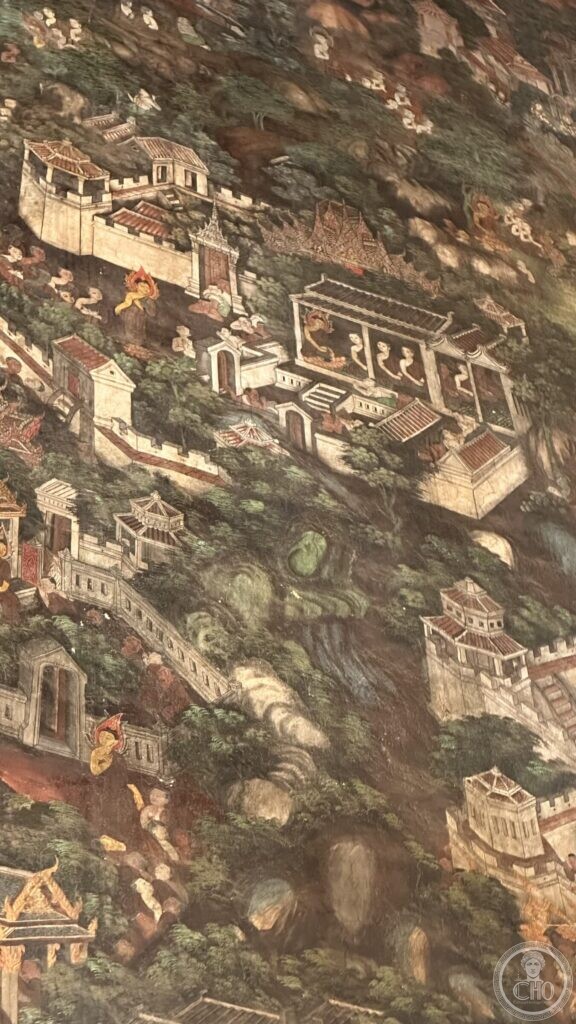 Detail of a Wat Suthat mural showing walled compounds with crenellated walls and shut gates among rocks and trees