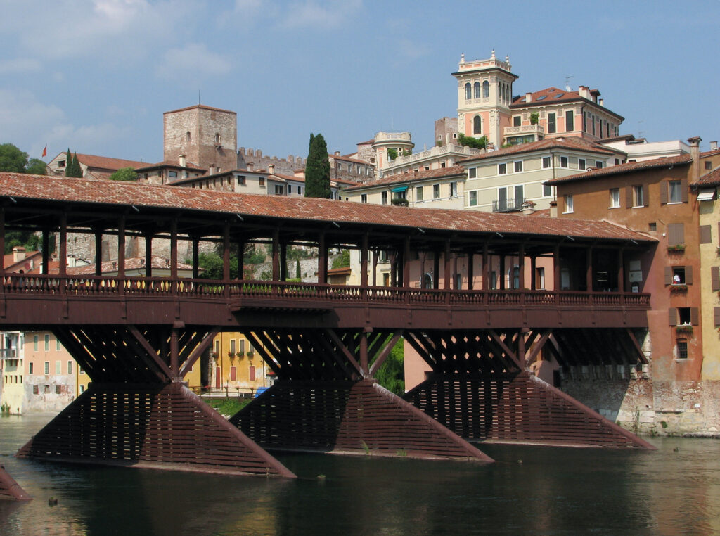 The historic covered wooden bridge Ponte degli Alpini crossing the Brenta river in Bassano