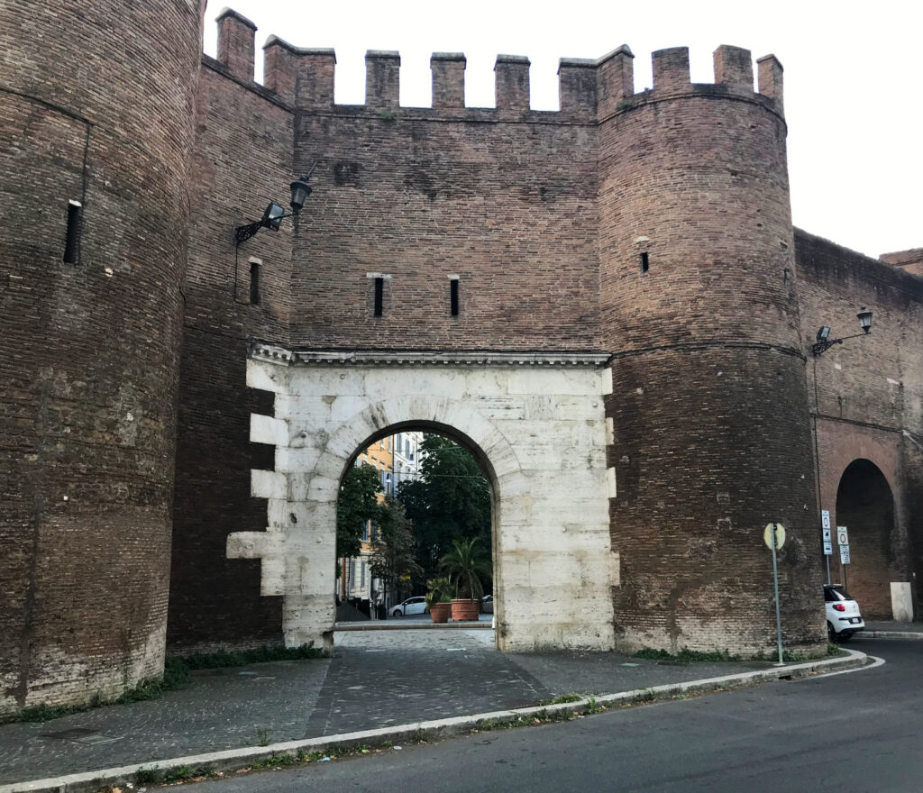Historic Roman brick gate Porta Pinciana at the top of Via Vittorio Veneto