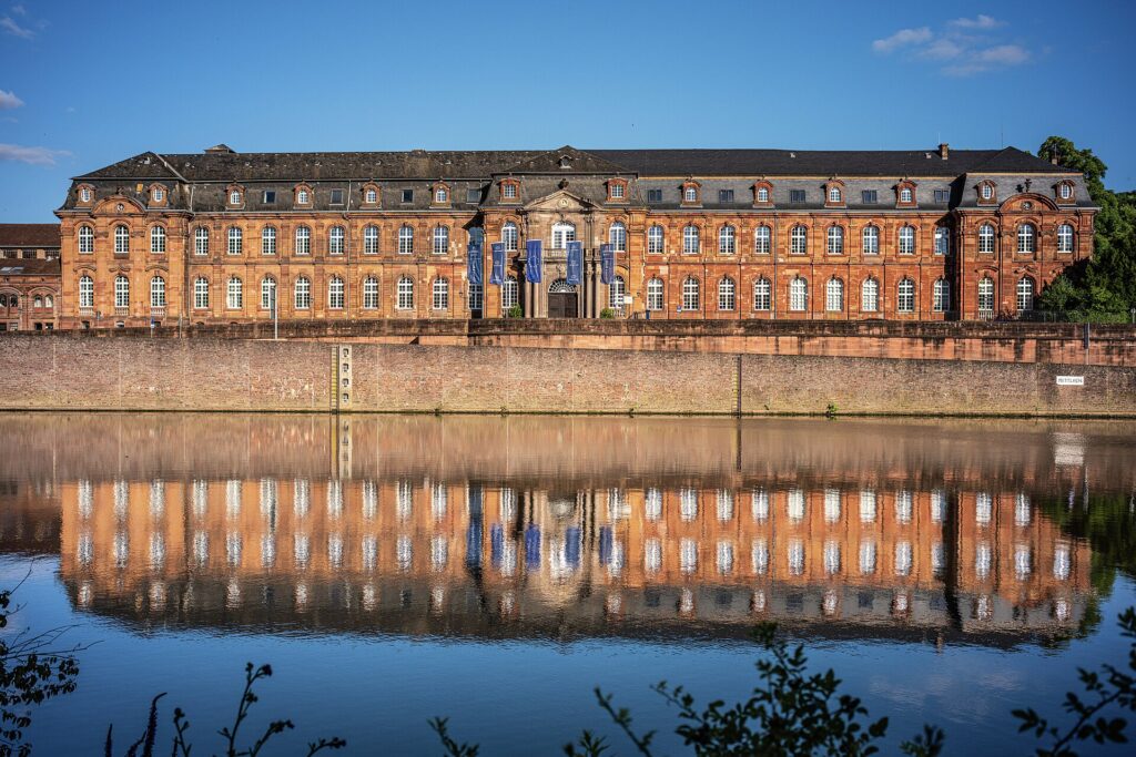 The Alte Abtei in Mettlach, Saarland, headquarters of Villeroy & Boch, reflected in the Saar