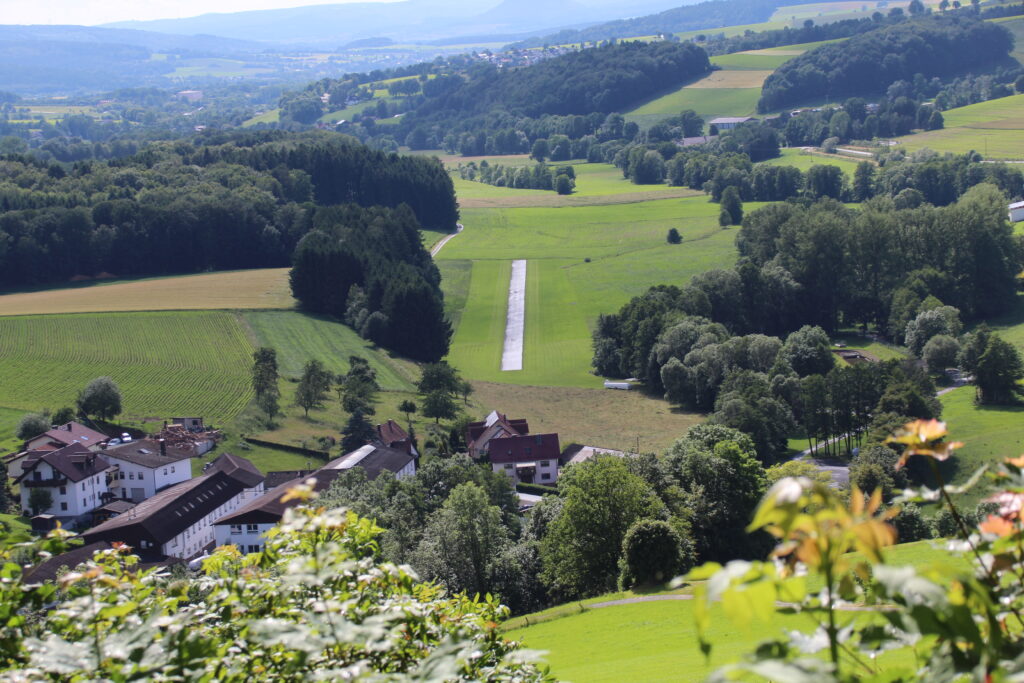 Aerial view of the Alexander Schleicher factory buildings and private airfield runway in Poppenhausen