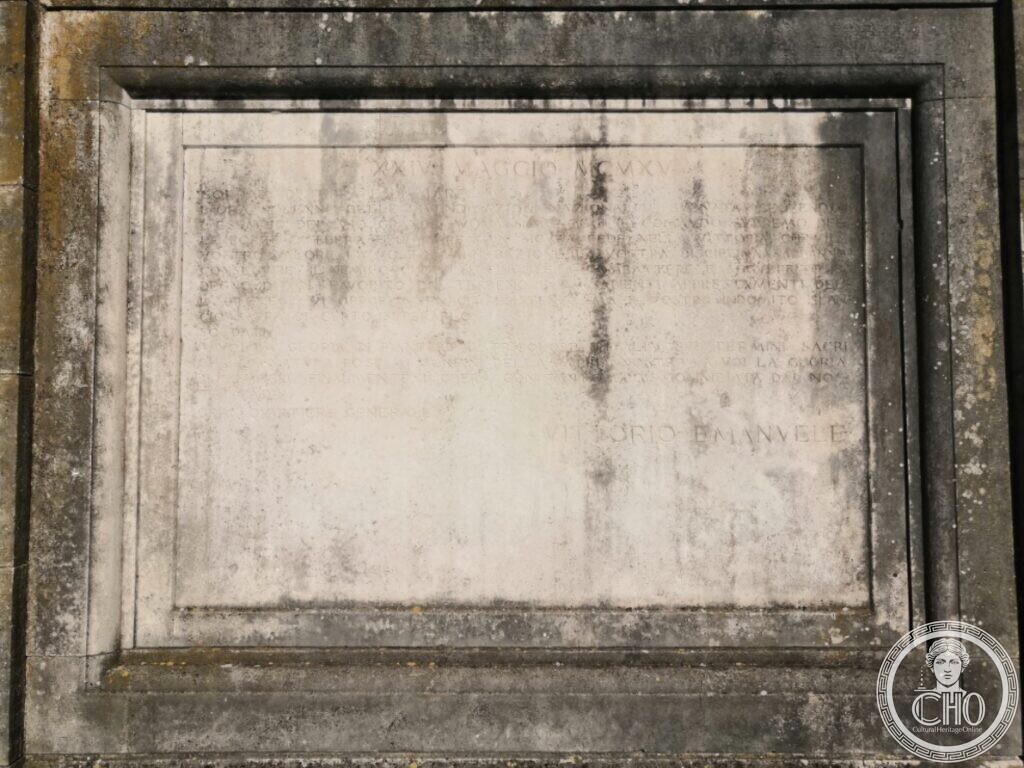 A weathered stone plaque in a moulded frame headed XXIV Maggio MCMXV and signed Vittorio Emanuele