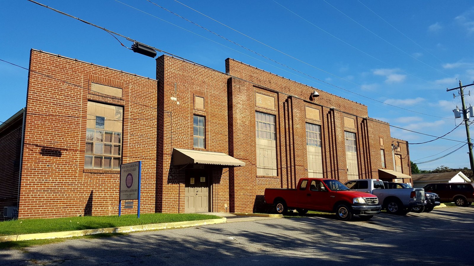 Olympia Armory brick building with stepped parapet and barrel-vaulted roof in Olympia, South Carolina