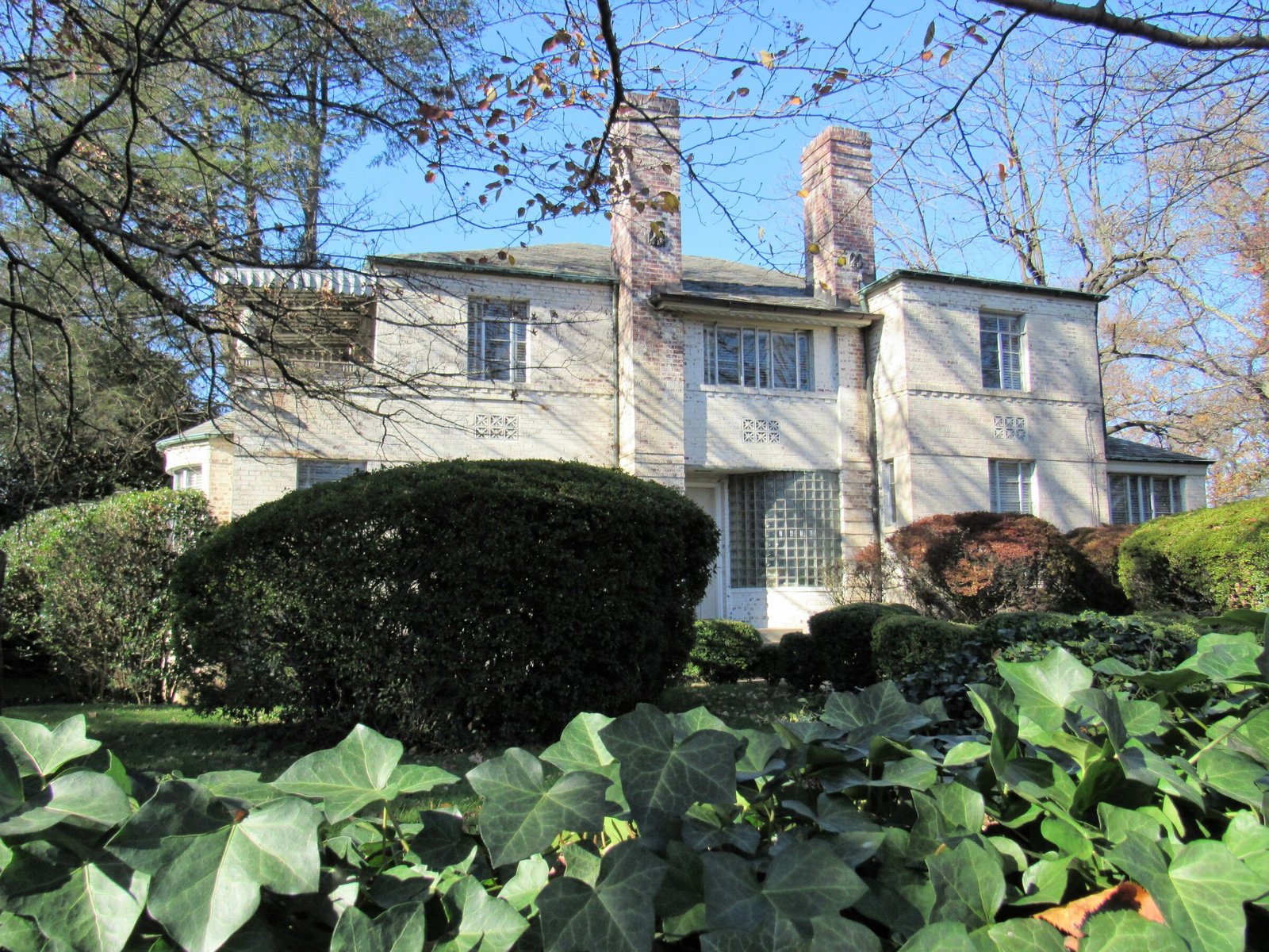 Mihran Mesrobian House Art Moderne whitewashed brick residence with glass block panels in Chevy Chase, Maryland